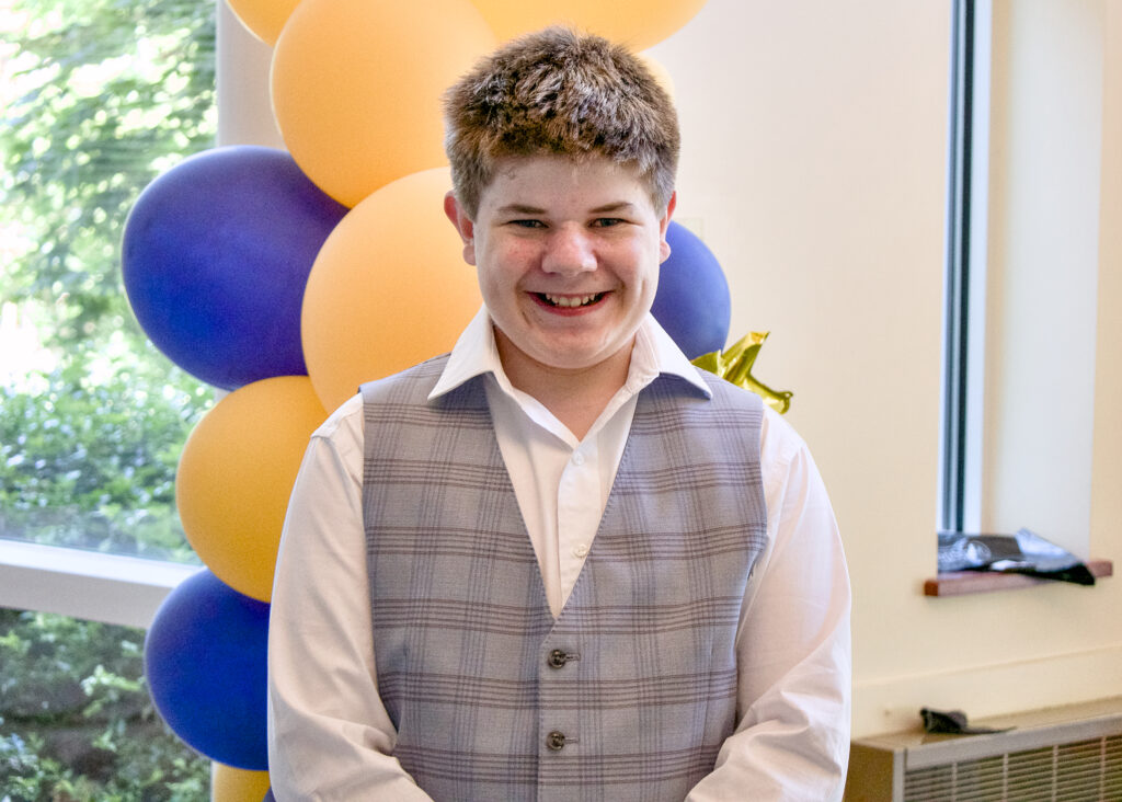 My son at his 8th grade graduation with a proud smile